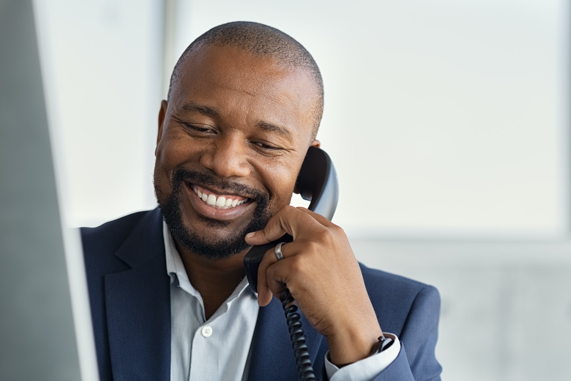 Mature black business man talking on phone